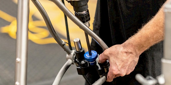 Bicycle mechanic facing disc brake mounts at BMCR in Adelaide