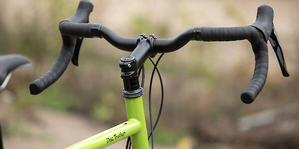 Surly Disc Trucker touring bike, handlebar detail, in Pea Lime Soup