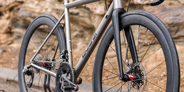Bossi Strada titanium road bike against a rocky outcrop