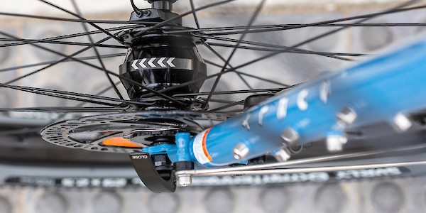 Dynamo hub laced into a hand-built wheel, fitted to a Surly Ogre bicycle in Tangled Up In Blue and viewed from above