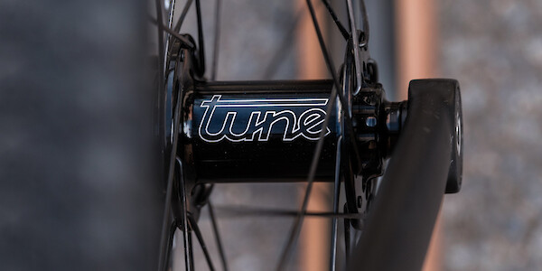 Close-up of a Tune bicycle hub in a hand-built wheel
