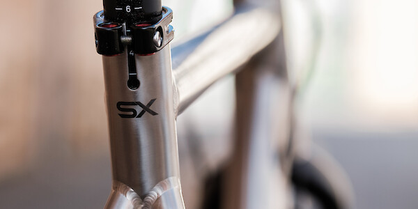 Seat tube frame detail on a Bossi Grit SX titanium gravel bike