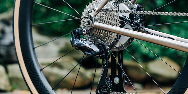 Cassette and rear derailleur detail on a custom-built Bossi Summit titanium road bike