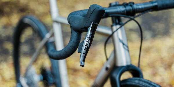 Sram Force shifter detail (right-hand) on a Bossi Grit SX custom bicycle, shown at an angle from the front
