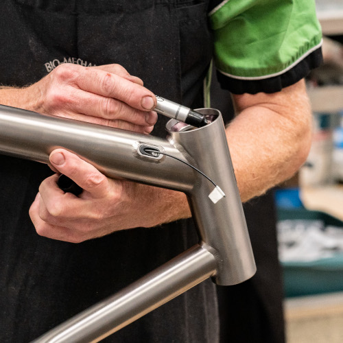 Pete from Bio-Mechanics Cycles & Repairs preparing the headtube of a titanium bicycle frame for machining work