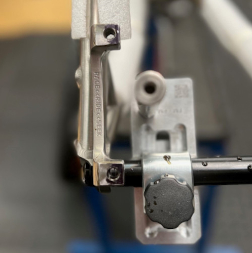 Disc mounts on a titanium bicycle frame prior to being properly faced; the black areas show the high spots which need to be shaved off