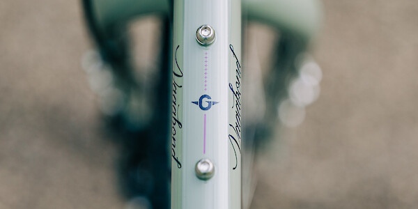Top tube mounting points and decal detail on a Genesis Vagabond bicycle