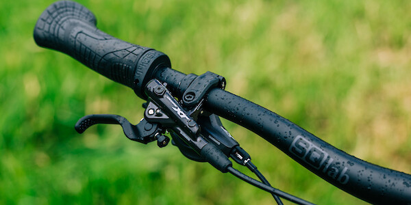 SQLab handlebars and grips plus a Shimano XT brake lever on a custom-built Surly Karate Monkey bicycle.