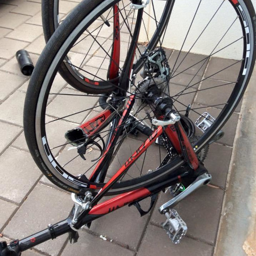 A carbon bicycle after an accident, broken into pieces