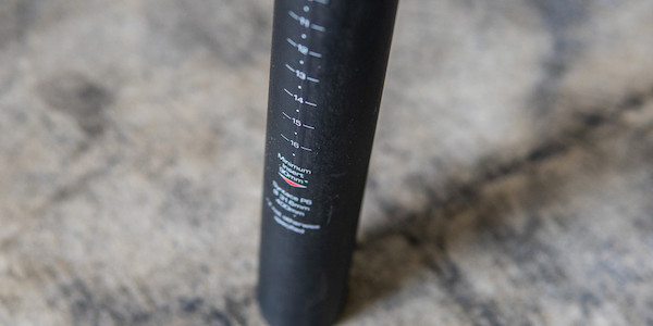 Base of a Syntace P6 HiFlex carbon seat post, showing the height markings