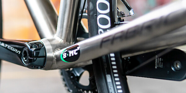 A BMCR sticker on the chain stay of a Bossi titanium bicycle frame