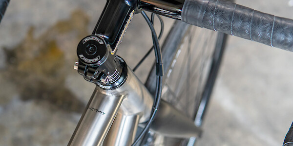 Top tube and headstem detail on a titanium Bossi Summit bicycle, viewed from above
