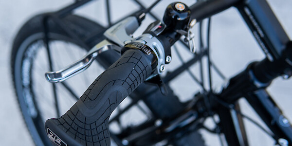 An SQ-Lab 710 grip on a black custom-built Surly Ogre touring bicycle