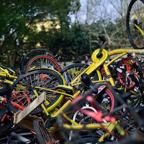 A jumbled pile of discarded bicycles