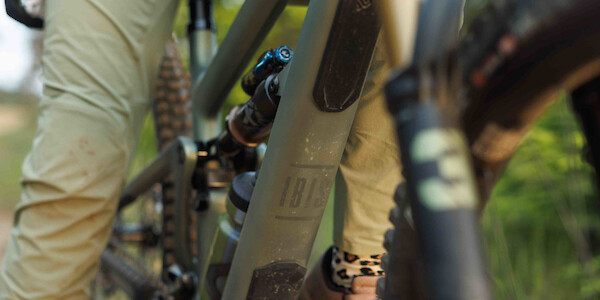 Ibis Ripmo 3 downtube protection, Olive Green Swamp Monster speckled with mud post-ride