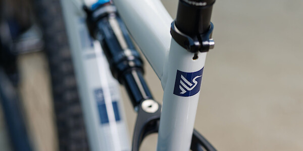 Seat tube logo detail on an Ibis Cycles Ripley AF in Protein Shake White
