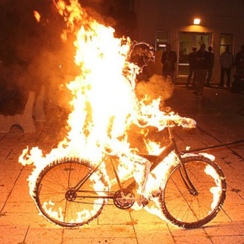 A bicycle engulfed in flames