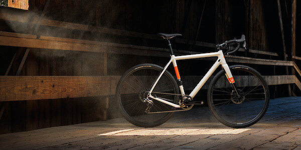 Ibis Hakka MX bicycle in Saltwater Taffy, photographed in a moody warehouse environment