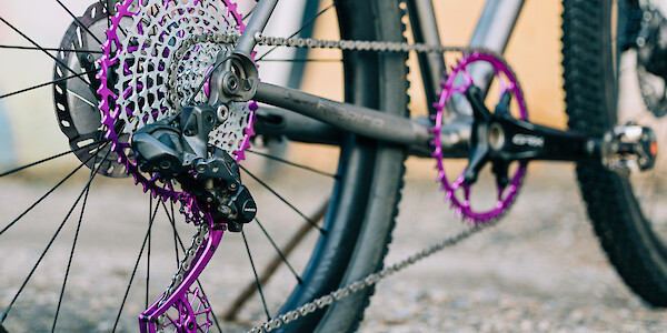 Garbaruk bicycle components in purple/violet, fitted to a titanium gravel bike