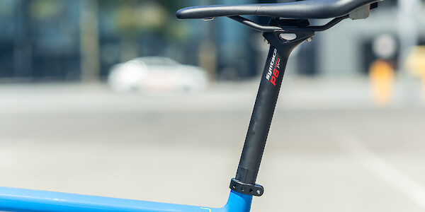 An SQ-Lab saddle and Syntace carbon seat post on an Open U.P. carbon bicycle, viewed from the side