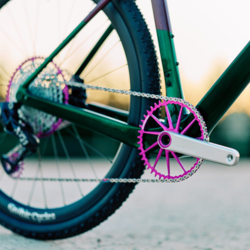Drivetrain detail of violet Garbaruk bicycle components fitted to a carbon Gothic Cycles gravel bike