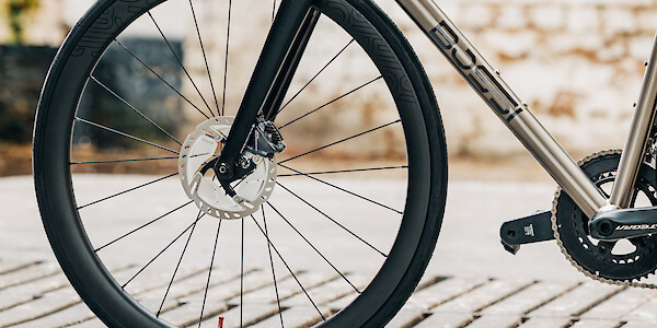 Front wheel detail on a Bossi Strada titanium road bike