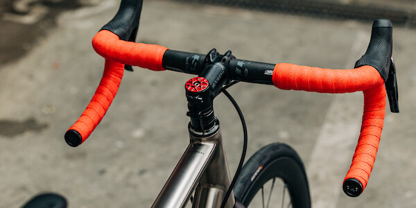 Bossi Strada titanium road bike, shot from above to show the red Garbaruk top cap and matching red handlebar tape