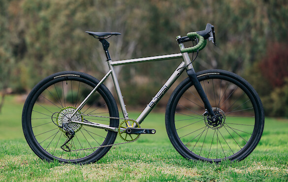 Bossi Grit SX titanium gravel bike, against a backdrop of greenery