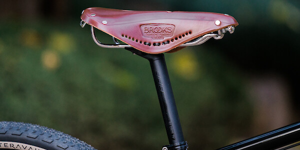 A Brooks leather saddle fitted to a Surly Bridge Club bike, viewed from the side