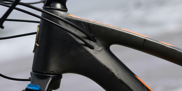 Frame detail on a Ibis Exie carbon mountain bike in Cheat-O Orange