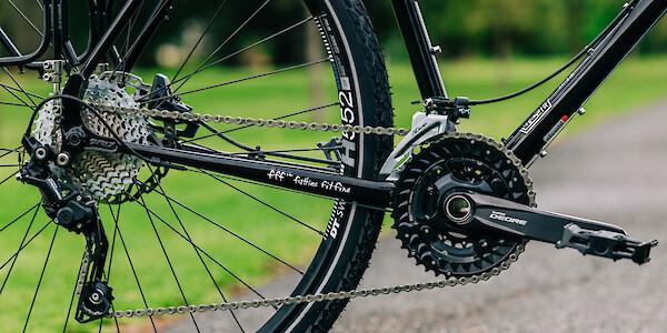Drivetrain/gears detail on a custom-built black Surly Disc Trucker steel touring bike.