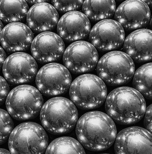 Close-up of a series of silver ball bearings