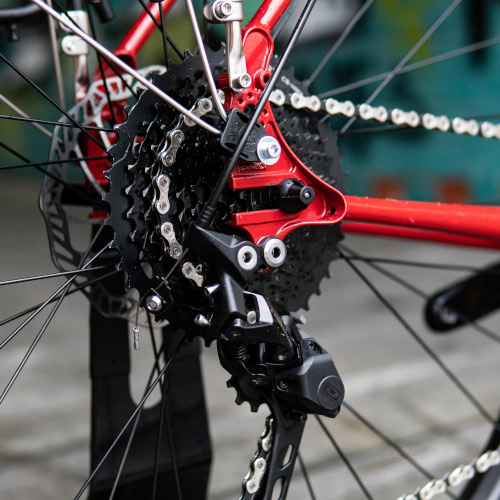 Rear derailleur hanger built into a red Surly Ogre frame