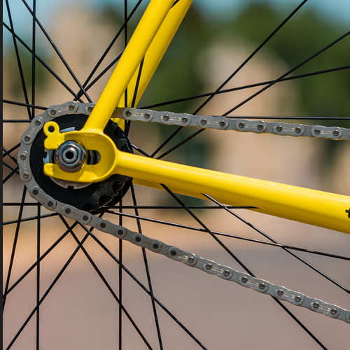 A yellow Surly Steamroller singlespeed frame, close up on the dropout