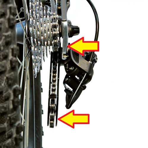 Close-up of a bent derailleur and rear derailleur hanger, arrows pointing to the areas of misalignment.