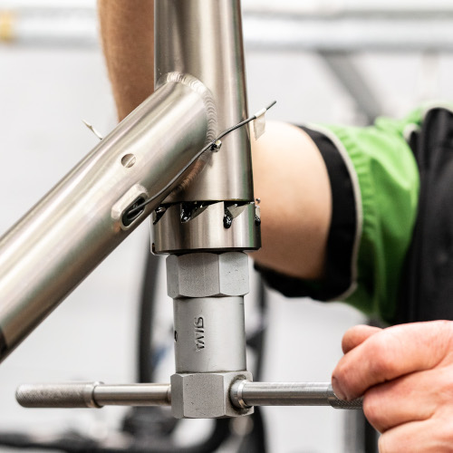 Facing work being done on a bicycle frame head tube at Bio-Mechanics Cycles & Repairs in South Australia.