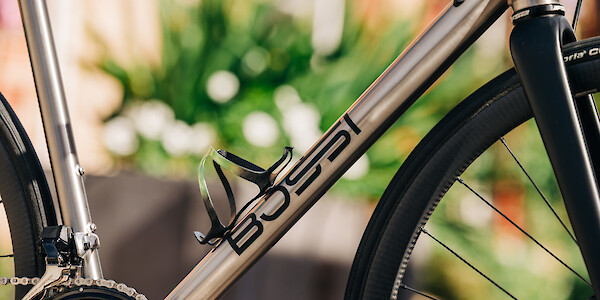 A hand-painted Ciclovation bottle cage, fitted to a A Bossi Strada Classic titanium road bike, custom-built by Bio-Mechanics Cycles & Repairs