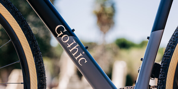 Frame detail on a Gothic Cycles Aix carbon gravel bicycle, created by Bio-Mechanics Cycles & Repairs, focusing on the 'Gothic' decal.