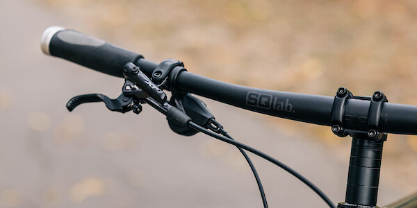 SQLab handlebar detail on an Esker Hayduke touring mountain bike, custom-built by Bio-Mechanics Cycles & Repairs.