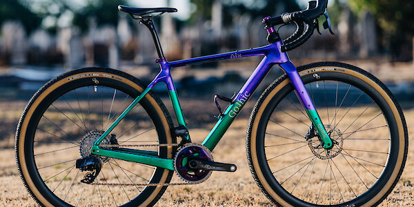 Custom-built Gothic Aix carbon gravel bike in sparkle emerald green/purple, full side view