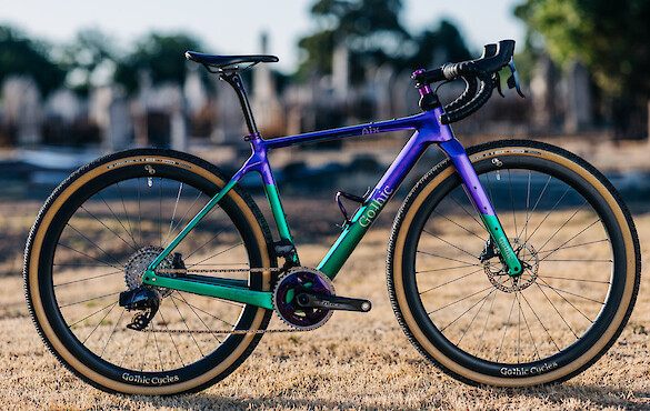 Custom-built Gothic Aix carbon gravel bike in sparkle emerald green/purple, full side view