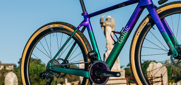 Custom-built Gothic Aix carbon gravel bike in sparkle emerald green/purple, partial side view