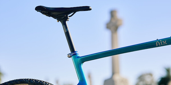 Carbon frame and Newmen carbon seatpost detail on a custom-build Gothic Cycles gravel bike.