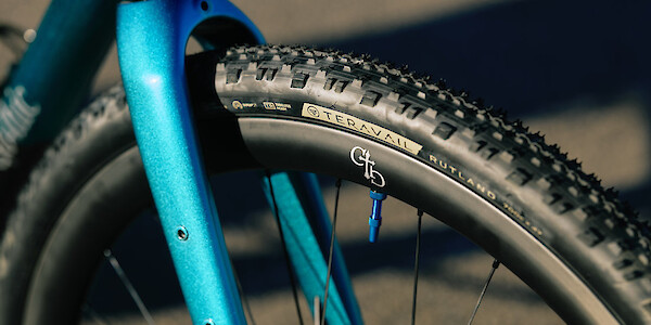 Fork and wheel detail on a Gothic Cycles carbon gravel bike