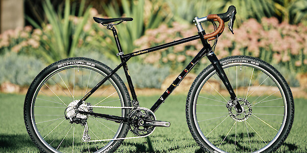 Custom-built Veloci Roadmance steel gravel bicycle by Bio-Mechanics Cycles & Repairs, photographed in a garden setting