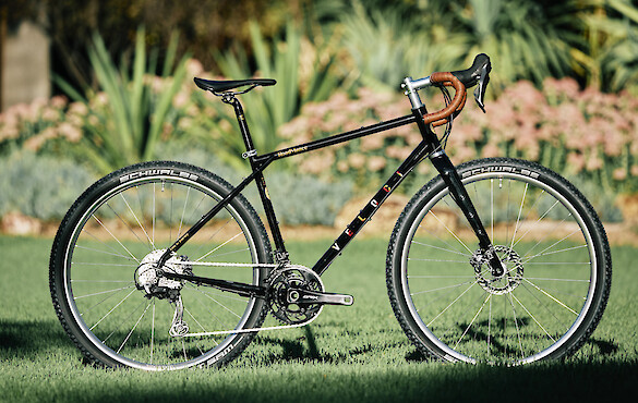 Custom-built Veloci Roadmance steel gravel bicycle by Bio-Mechanics Cycles & Repairs, photographed in a garden setting