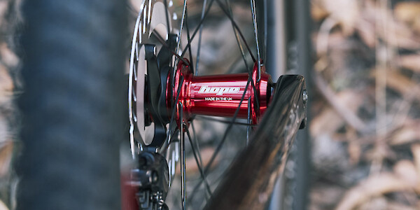 Red Hope Pro 5 hub laced into a carbon Gothic Cycles wheel