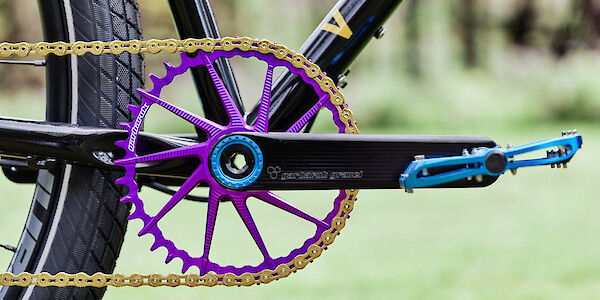 Black Garbaruk crankset and purple chainring with gold KMC chain on single-speed Veloci Roadmance